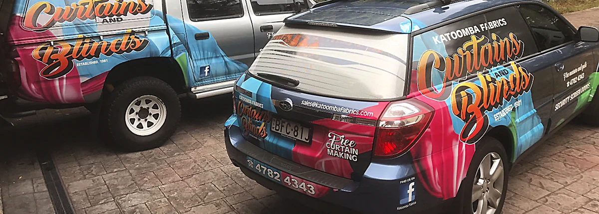 Two Katoomba Fabrics vehicles wrapped in the Curtains and Blinds livery
