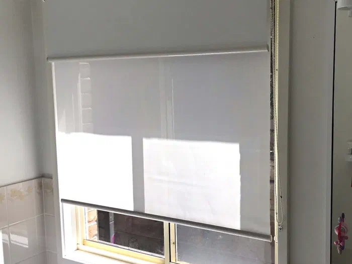 Double rollers with light filtering fabric to allow light and blockout to stop full sun and night time privacy